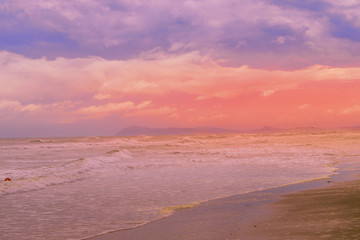 sunset at beach on a bad weather day