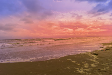 Fototapeta na wymiar sunset at beach on a bad weather day