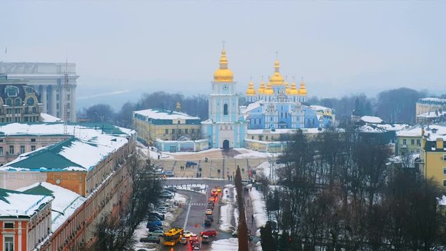 Kyiv, Ukraine. Video of sunset in Kyiv, Ukraine, with a view of the St Michaels Golden - Domed Monastery and traffic on a winter day with a gloomy sky. 