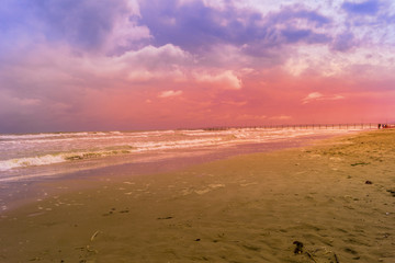 sunset at beach on a bad weather day