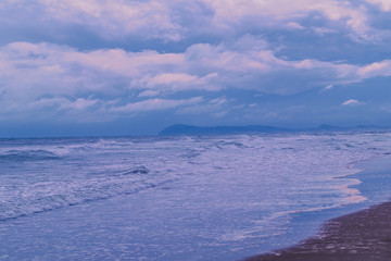Fototapeta premium beach at blue hour on a bad weather day