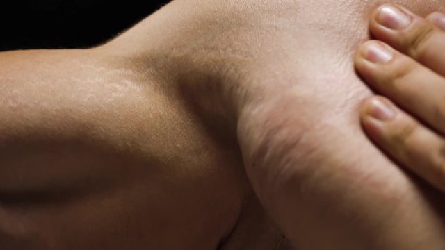 Male stretch marks on the skin of the hands, shoulders and chest close-up