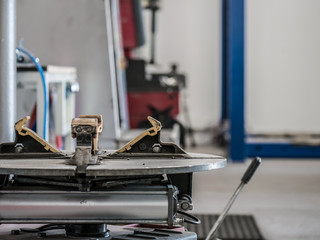Tire changing machine in a workshop. Tire changing machine closeup.