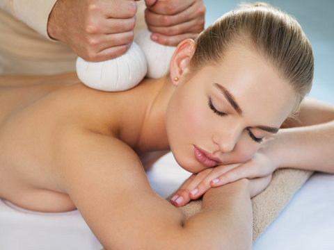Woman getting  massage with hot stones