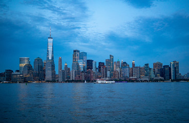 downtown Manhattan in the evening with boat