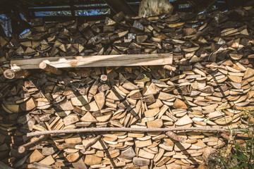 Stack of firewood ready for winter in a backyard