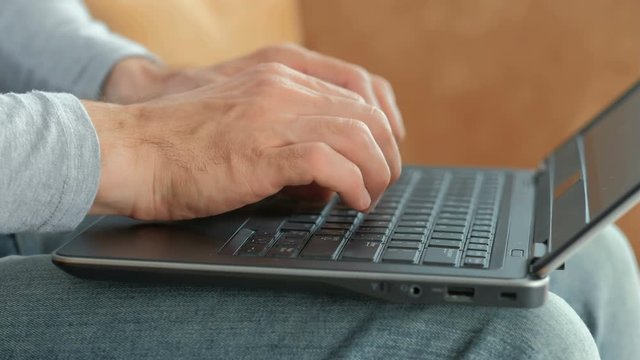 blogger blogging and social media concept. man hands typing on the laptop writing new post.
