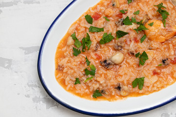 rice with seafood on white dish