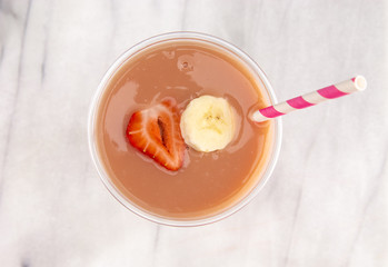 Strawberry and Banana Smoothie in a Disposable Plastic Cup