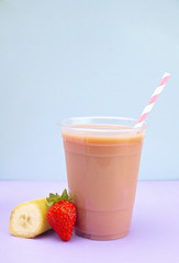 Strawberry and Banana Smoothie in a Disposable Plastic Cup