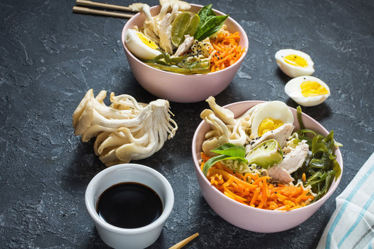 Miso Ramen Asian noodles in bowls on dark stone background
