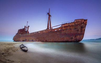 Fototapeta premium Greek coastline with the famous rusty shipwreck in Glyfada beach near Gytheio, Gythio Laconia Peloponnese Greece.