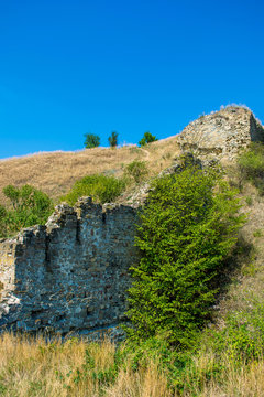 Photo of ancient stone collapsed castle wall in Khotym
