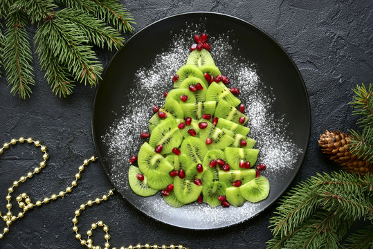 Edible christmas tree from kiwi slices.Top view.