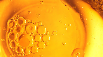 Yellow bubbles background, cooking oil emulsion, frying. - obrazy, fototapety, plakaty