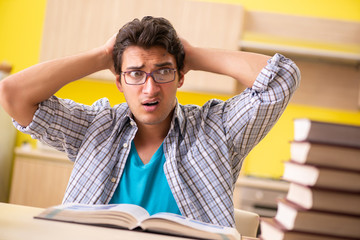 Student preparing for exam sitting at the kitchen 