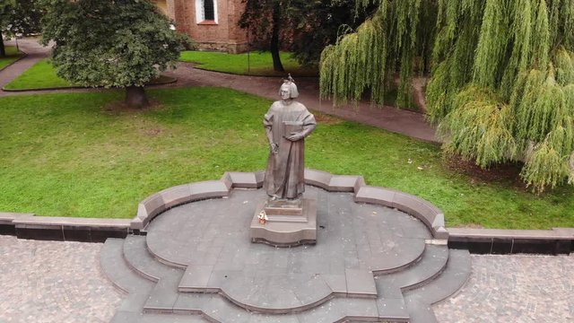 Aerial view of Yuriy Drohobych monument in Drohobych city, Ukraine. Smooth fly around technique. Also known as Yuriy Kotermak, Giorgio da Leopoli