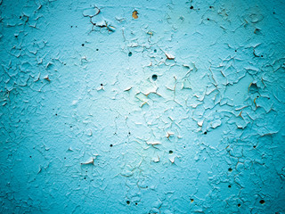 Close-up  of cracked paint on  metal wall