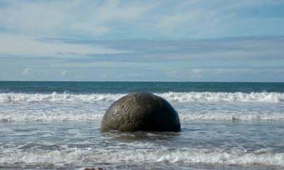 round boulder at the beach © Jake