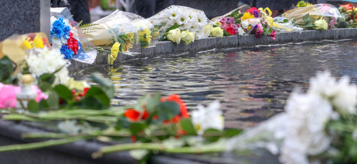 Memorial Flowers Near Water Pool 