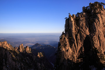 Obraz premium Huangshan China National Park - Anhui Province, Chinese Mountain Peak. Sea of Fog, Yellow Granite Mountains with Canyon, Exotic Pine Trees and Forest, Jagged Cliffs, UNESCO World Heritage Site