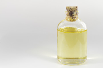 glass jar with castor oil isolated on white background
