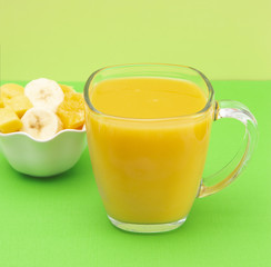 Orange, Banana and Mango Smoothie in a Glass Mug