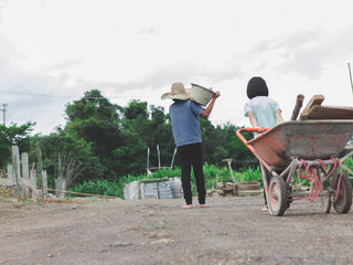 Children working at construction site for world day against children labour concept: