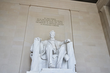 Marble statute of Abraham Lincoln sitting located in Washington DC.