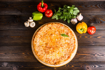 Italian pizza. Creative author's pizza with with cheese