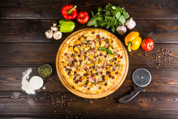 Country pizza is four kinds in one - mushrooms, chicken, bacon, meat. Pizza cutter