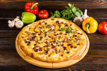 Pizza is four kinds in one - mushrooms, chicken, bacon, meat.