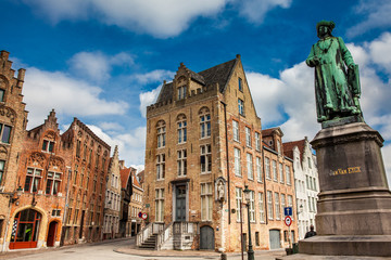 Statue of the painter Jan Van Eyck at the historical town of Bruges in Belgium