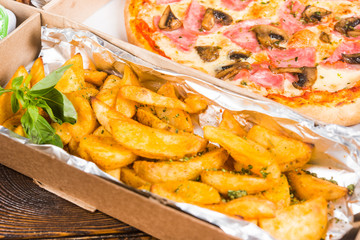 Seth: Pizza in a cardboard box with French fries