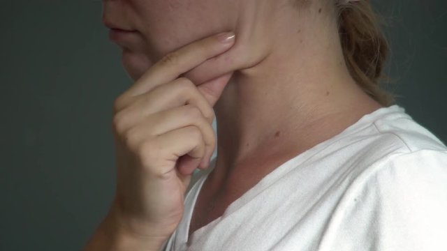 Young Caucasian Woman Examining Double Chin. Facial Line Correction