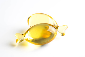 omega capsules on white fish shape