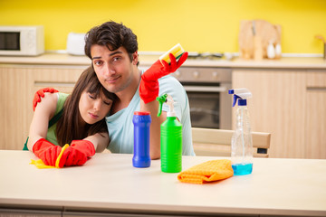 Young couple working at kitchen 