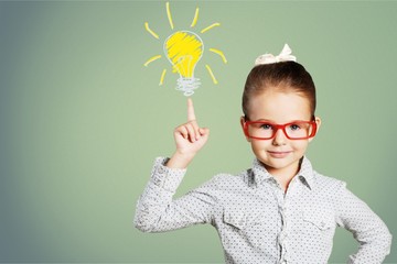 Little girl has and idea on chalkboard background
