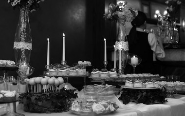 table with sweets and a variety of sweet snacks against the back