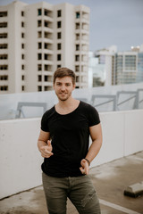 Young Fit Trendy Guy Modeling on Top of Downtown Parking Garage