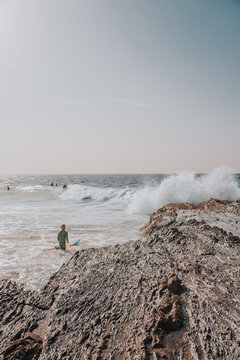 grom paddles out at snapper rocks