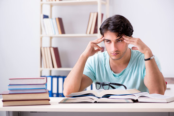 Young handsome student preparing for school exams