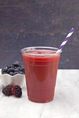 Berry Smoothie in a Plastic Disposable Cup