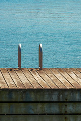 Fototapeta premium Empty dock, pier with ladder, concept, background, abstract & copy space