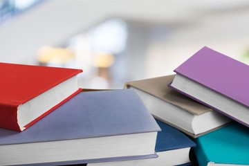 Books collection on dark background with copy space