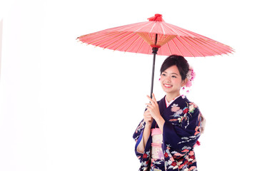 portrait of young asian woman wearing purple kimono on white background