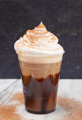 Iced Mocha in a Disposable Plastic Cup with Whipped Cream