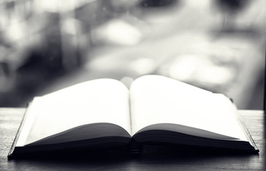 open book and a table black and white