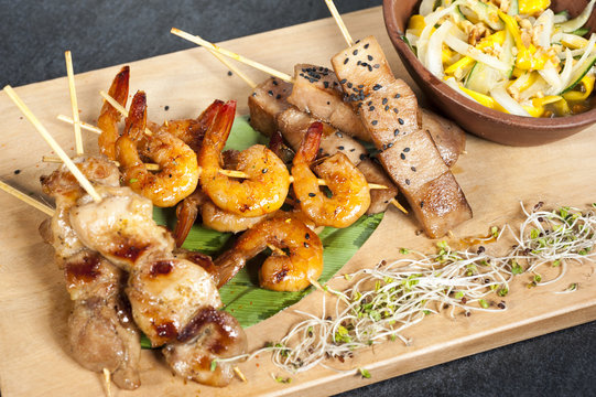 Mixed skewers, chicken, fish and cow meat