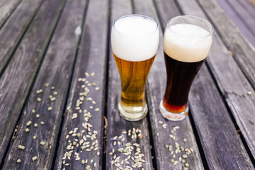 Glass of a tasty home made beer on table